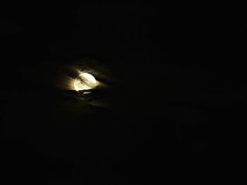 Low angle view of illuminated street light against sky at night