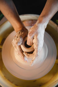 Cropped hand of person working in workshop