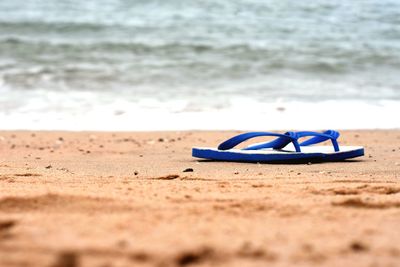 High angle view of shoes on beach