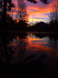 Scenic view of lake at sunset