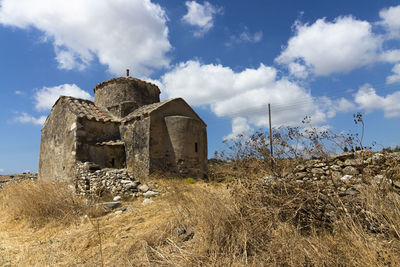 Low angle view of old building against sky