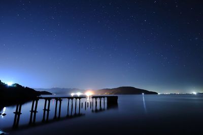 Scenic view of sea against sky at night