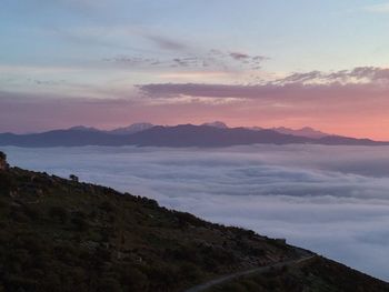 Scenic view of mountains against sky during sunset