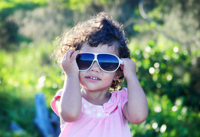 Portrait of cute girl wearing sunglasses