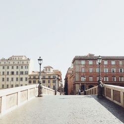 View of buildings in city against clear sky