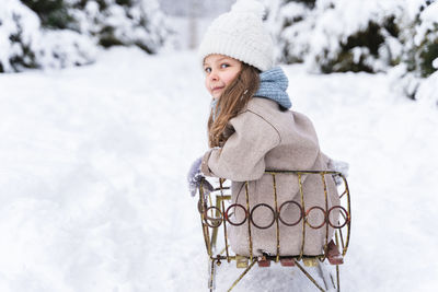 Portrait of woman wearing hat during winter