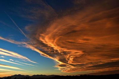 Scenic view of landscape against sky during sunset