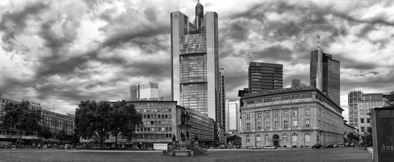 architecture, building exterior, built structure, city, sky, cloud - sky, skyscraper, modern, men, tower, tall - high, office building, cloudy, lifestyles, city life, cloud, leisure activity, person, building