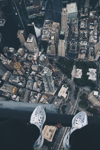 Low section of man and cityscape