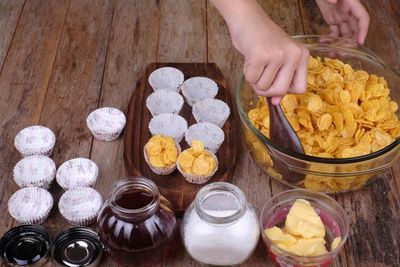 High angle view of person preparing food on table