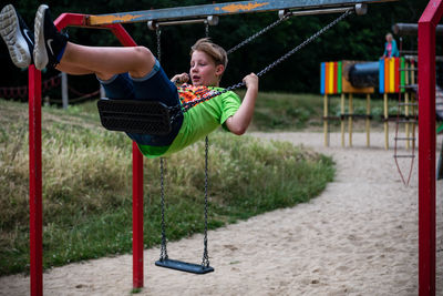 Boy on swing at playground