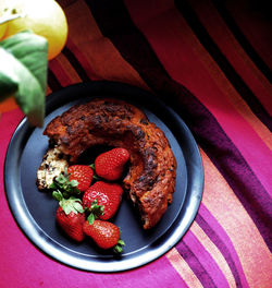 High angle view of strawberries in plate on table