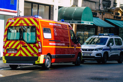 Cars on road against buildings