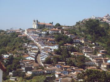 Houses in town against clear sky