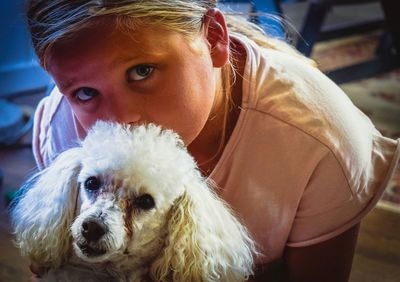 Portrait of cute girl with dog