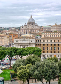 View of trees and buildings against sky