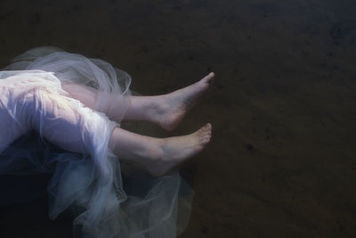 Woman legs in a water