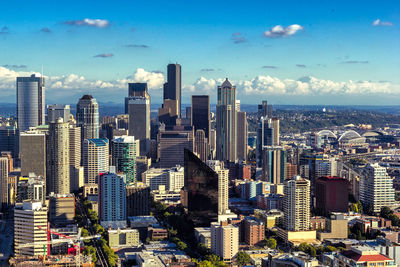 Aerial view of modern buildings in city against sky