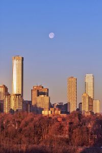 Modern buildings against clear sky in city