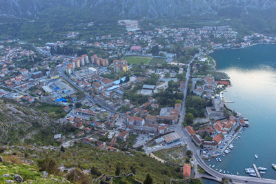 High angle view of buildings and sea in town