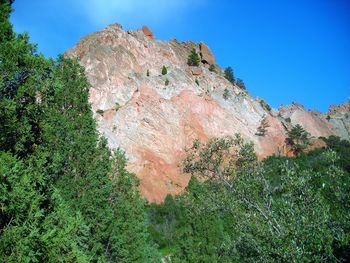 Low angle view of rocks against sky