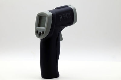 Close-up of camera against white background