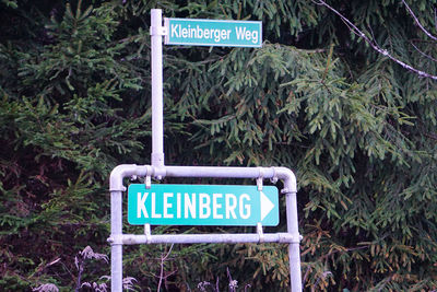 Information sign by trees and plants