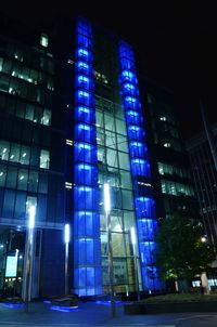 Low angle view of illuminated building at night