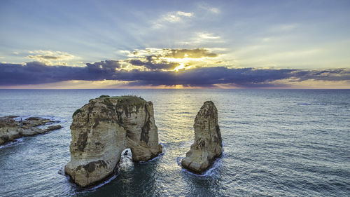 Scenic view of sea against sky at sunset