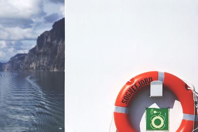 Orange life belt on ferry at sea