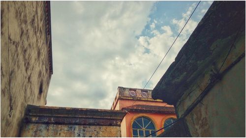 High section of building against cloudy sky