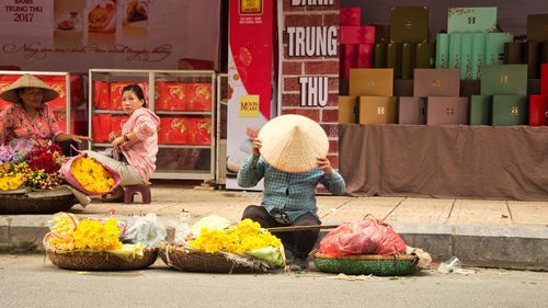 Full length of woman at market stall