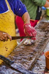 Midsection of person preparing food on table