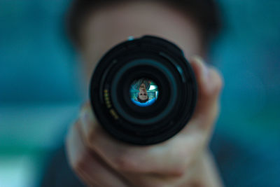 Close-up of hand holding camera