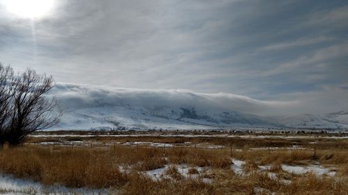 Scenic view of snow field against sky