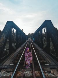 Low angle view of railroad tracks against sky