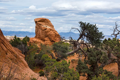 Rock formations on landscape against sky