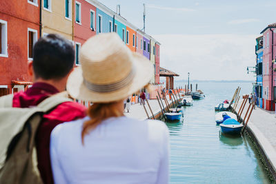 Rear view of people on boat at sea