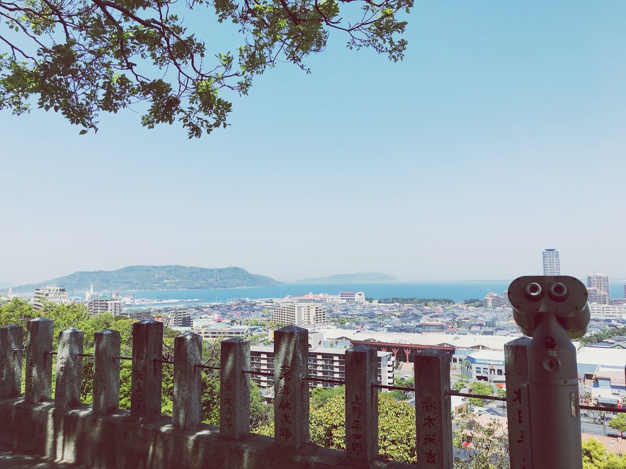 sky, nature, day, clear sky, water, coin operated, no people, plant, sea, scenics - nature, beauty in nature, security, binoculars, outdoors, tranquility, barrier, tree, boundary, tranquil scene, wooden post