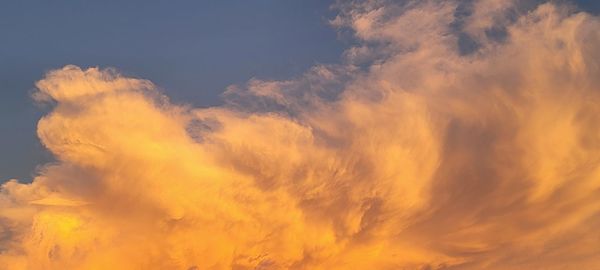 Low angle view of dramatic sky during sunset