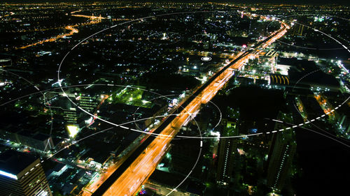 High angle view of illuminated cityscape at night