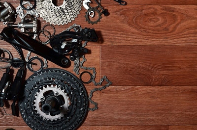 Directly above shot of bicycle chain and gears on table