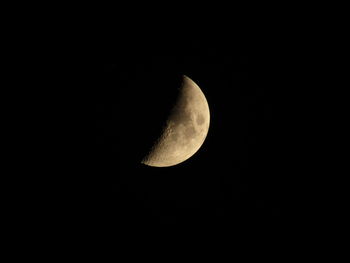 Low angle view of moon against sky at night