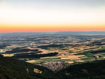 High angle view of field against sky during sunset