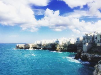 Scenic view of sea against cloudy sky