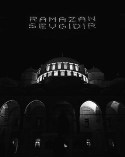 Low angle view of illuminated building at night