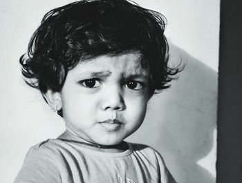 Close-up portrait of cute boy at home
