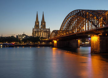 Arch bridge over river in city