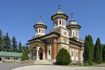 Low angle view of building against clear blue sky