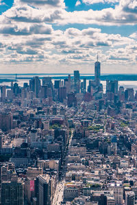 Cityscape against cloudy sky